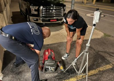 DC Joel Lee teaching recruit Amanda Alberti how to properly use a 2000W generator and set up a tower light